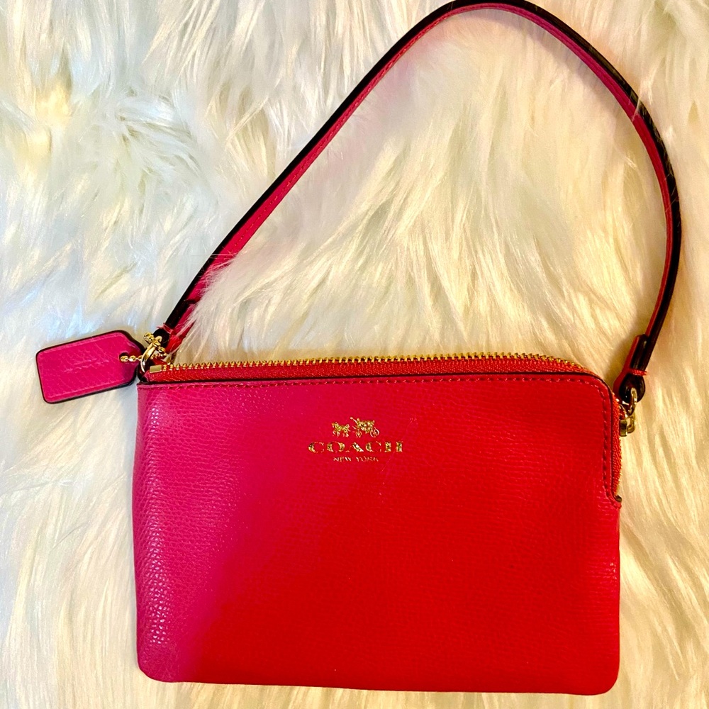 COACH-PRETTY PINK COACH WRISTLET/WALLET IN LIKE NEW CONDITION. YOU WILL.